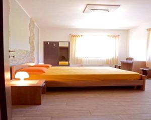 A bed or beds in a room at Spacious Apartment in Zafferana Etnea 65 m² with Private Garden