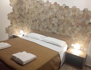 A bed or beds in a room at Spacious Apartment in Zafferana Etnea 65 m² with Private Garden