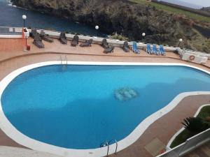 Vista sulla piscina di Studio at Playa San Marcos 20 m away from the beach with sea view shared pool and furnished terrace o su una piscina nei dintorni