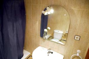 a bathroom with a sink and a mirror at 3 bedrooms apartement at Puerto de Mazarron 30 m away from the beach with furnished terrace and wifi in Puerto de Mazarrón