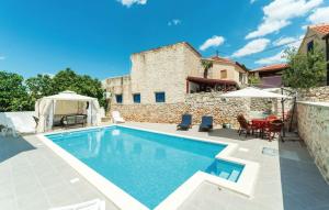 an image of a swimming pool in a villa at 4 bedrooms villa with private pool enclosed garden and wifi at Jezera in Jezera
