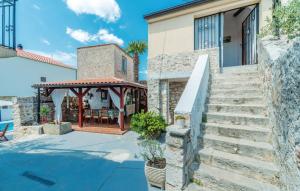 a house with a staircase and a gazebo at 4 bedrooms villa with private pool enclosed garden and wifi at Jezera in Jezera