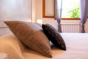 Ένα ή περισσότερα κρεβάτια σε δωμάτιο στο Appartement confortable au Bar-sur-Loup 60 m² avec jardin
