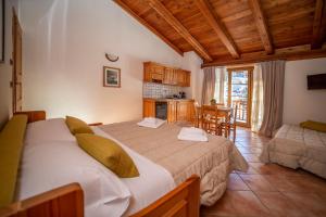 Postel nebo postele na pokoji v ubytování Residence Cascina Genzianella