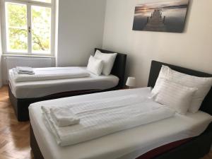Posteľ alebo postele v izbe v ubytovaní Vienna-apartment-one Schmidgasse