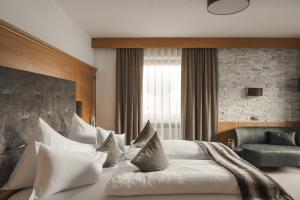 Posteľ alebo postele v izbe v ubytovaní Garni Hotel Platzer