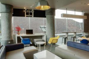 A television and/or entertainment centre at MD 7 Hotel Cirebon