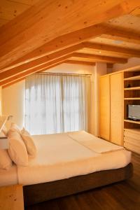 A bed or beds in a room at Chalet Corvara