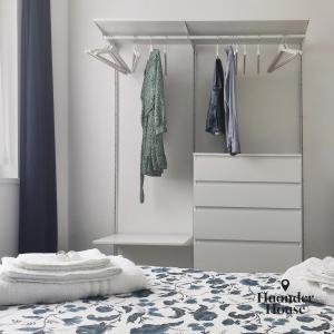 a bedroom with a bed and a dresser at Huonder House in Lecco +26 photos