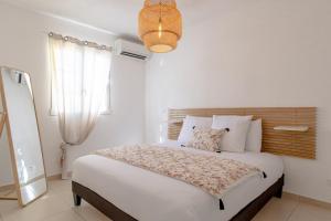 a bedroom with a large bed in a room at Orient Bay Beach Front Apartment in Orient Bay