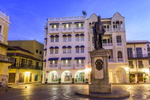 a statue of a man in front of a building at NH Royal Urban Cartagena in Cartagena de Indias