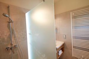 a bathroom with a shower and a sink at Landgasthof Fiedler in Dietersheim