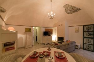 a living room with a table and a couch at NICE APARTMENT in Porto Santo Stefano