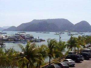 a view of a harbor with boats in the water at Geopark Hotel Kuah Langkawi in Kuah