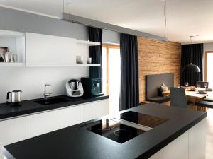 A kitchen or kitchenette at Chalet Bergzeit