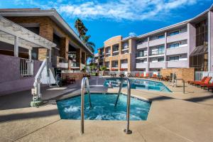 an image of a swimming pool at a apartment complex at La Quinta by Wyndham Pomona in Pomona