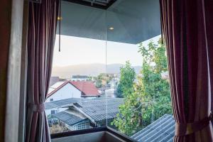 Balkón nebo terasa v ubytování WERUN NIMBLY CHIANG MAI