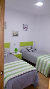 Un ou plusieurs lits dans un hébergement de l'établissement 2 bedrooms appartement at Riveira 1 km away from the beach