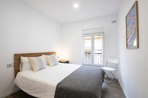 Postel nebo postele na pokoji v ubytování San Juan Guesthouse