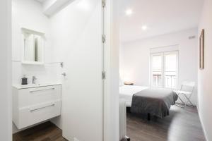 Postel nebo postele na pokoji v ubytování San Juan Guesthouse
