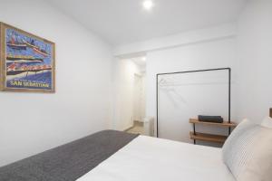 Postel nebo postele na pokoji v ubytování San Juan Guesthouse