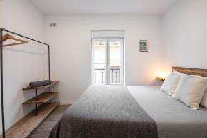 Postel nebo postele na pokoji v ubytování San Juan Guesthouse