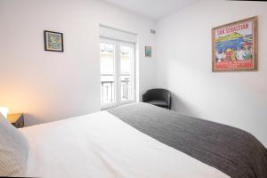 Postel nebo postele na pokoji v ubytování San Juan Guesthouse