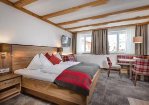 Postel nebo postele na pokoji v ubytování Apartments & Garni Alpenrose
