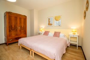 a bedroom with a large bed and two night stands at Agriturismo il Bio Nonno in Cento