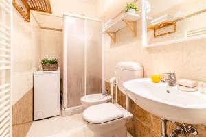a bathroom with a toilet and a sink and a shower at Agriturismo il Bio Nonno in Cento +31 photos