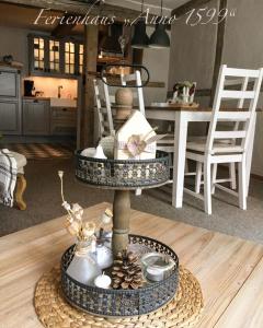 a living room with a table with a center at Ferienhaus Anno 1599 in Wernigerode