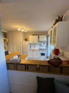 a small kitchen with a white stove top oven at appartement atypique en duplex in Palavas-les-Flots