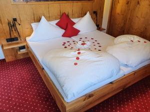 Ein Bett oder Betten in einem Zimmer der Unterkunft Alpenhotel Denninglehen