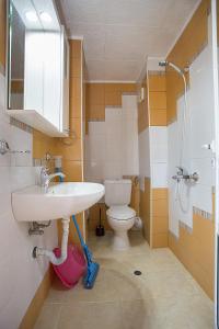 a bathroom with a sink and a toilet at Sineva Guest House in Ravda +112 photos