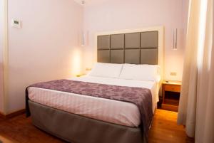 Cama ou camas em um quarto em Hotel Giolli Nazionale