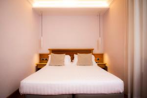 Cama ou camas em um quarto em Hotel Giolli Nazionale