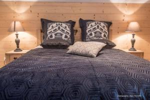 Ένα ή περισσότερα κρεβάτια σε δωμάτιο στο Chalet Charligustine - Gérardmer - 8p (4 étoiles)