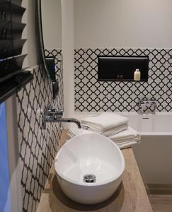a bathroom with a white sink and a toilet at B&B Punto Vélo in Zutendaal