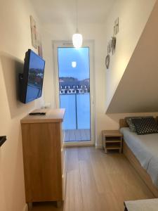 Telewizja i/lub zestaw kina domowego w obiekcie Apartament Diuna
