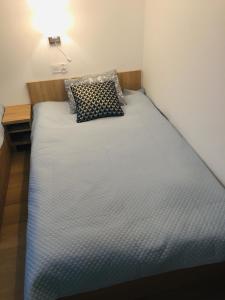 Łóżko lub łóżka w pokoju w obiekcie Apartament Diuna