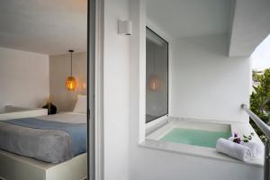 Ein Bett oder Betten in einem Zimmer der Unterkunft Galatia Villas