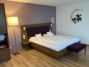 Postel nebo postele na pokoji v ubytování Gasthaus Hotel Kranz