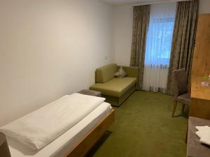 Postel nebo postele na pokoji v ubytování Gasthaus Hotel Kranz