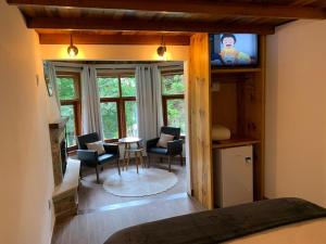 TV a/nebo společenská místnost v ubytování Pousada Opas Haus