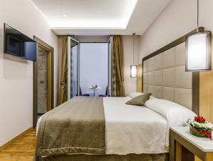 Cama ou camas em um quarto em Hotel Giolli Nazionale