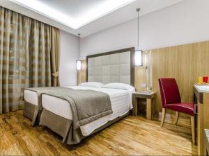 Cama ou camas em um quarto em Hotel Giolli Nazionale