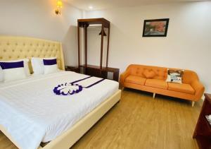 Letto o letti in una camera di Peach Valley Hotel Dalat