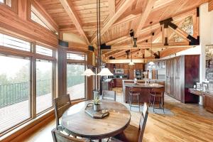 a kitchen and dining room with a wooden ceiling at High Road Estate in Kalispell