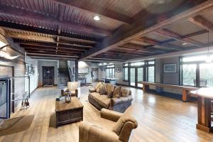 a large living room with couches and a table at High Road Estate in Kalispell
