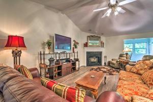 a living room with couches and a tv and a fireplace at Hot Springs Escape Less Than 2 Miles to the Lake! in Hot Springs Village
